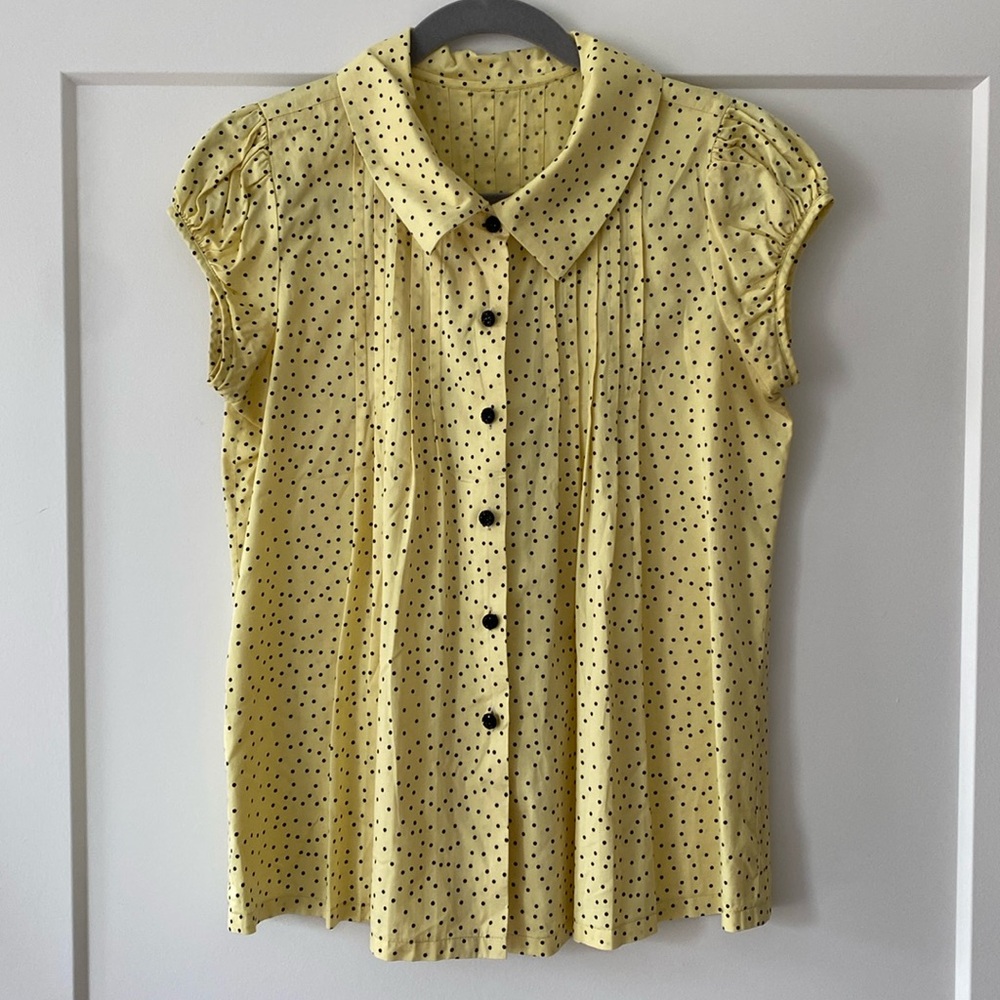 Yellow and black polka-dot blouse